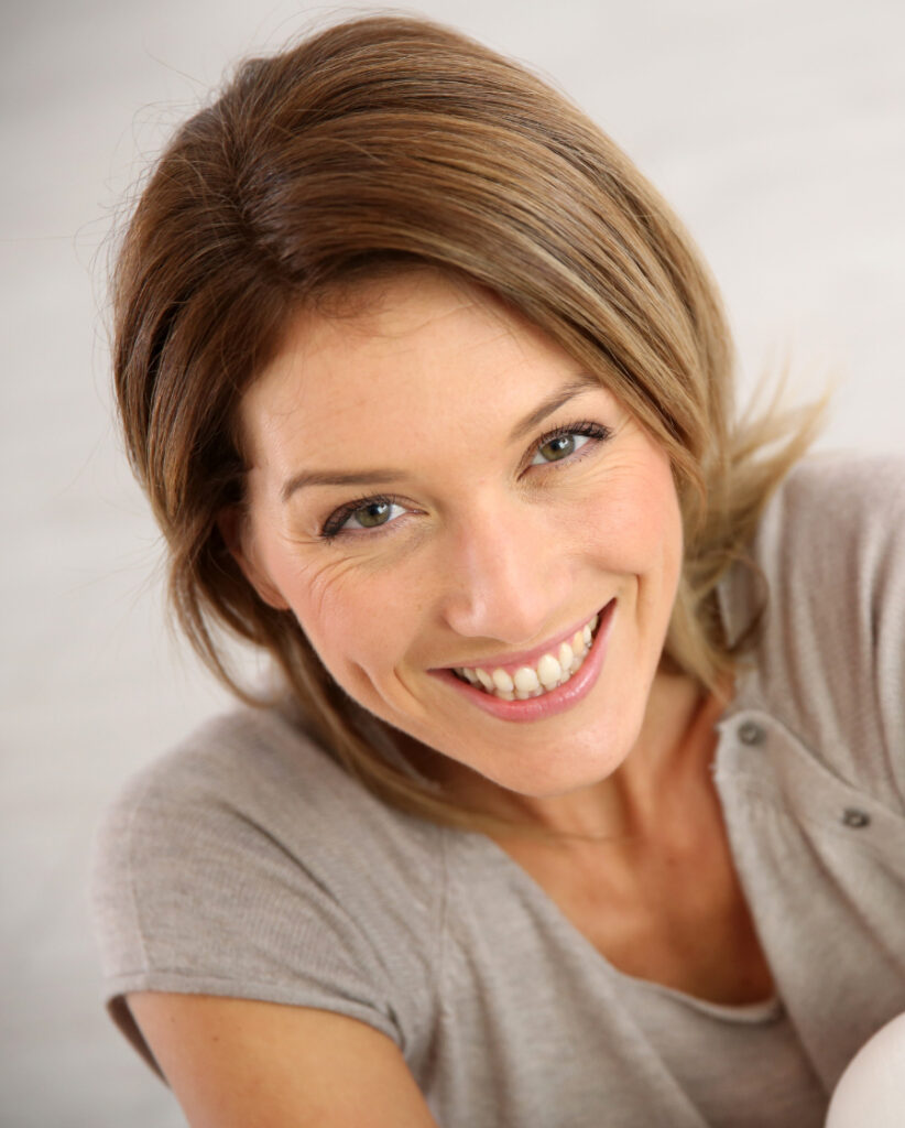 Photo of a smiling woman with great skin