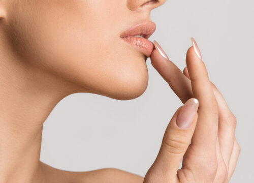 Photo of a woman touching her lips